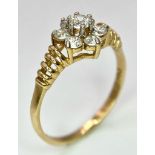 A very showy 14 K yellow gold ring with a cluster of Cubic Zirconia on top. Ring size: N1/2, weight: