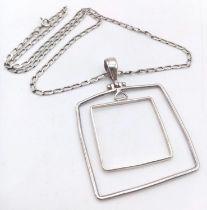 A glorious 925 silver double-square pendant on silver curb chain. Total weight 13.3G. Total length