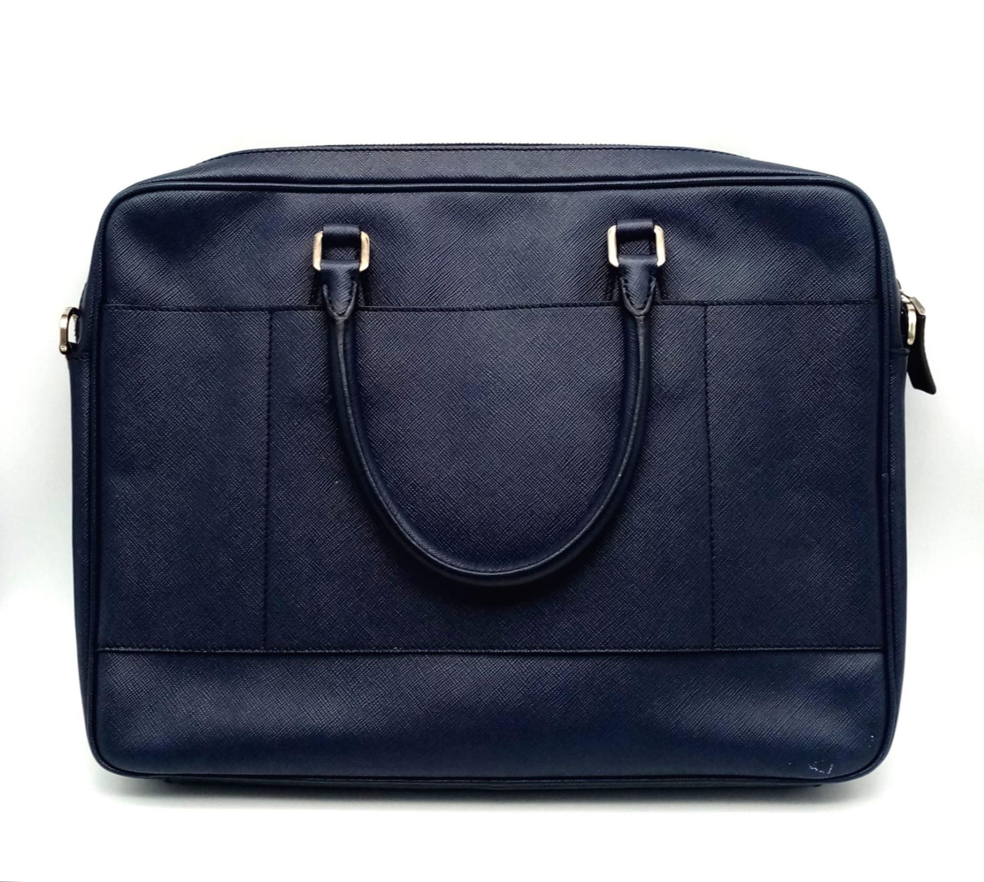 A Prada Saffiano Briefcase. Navy blue textured leather exterior. Prada logo badge. Name tag. Quality - Image 2 of 6