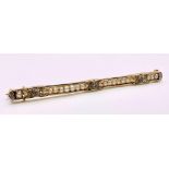 An Antique Mid-Karat Gold, Pearl and Diamond Bar Brooch. 6.5cm length. 5.24g total weight.