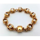 A Designer (Gio Caroli) 18K Yellow Gold and Pearl Bracelet. Nine beautiful South Sea pearls - each