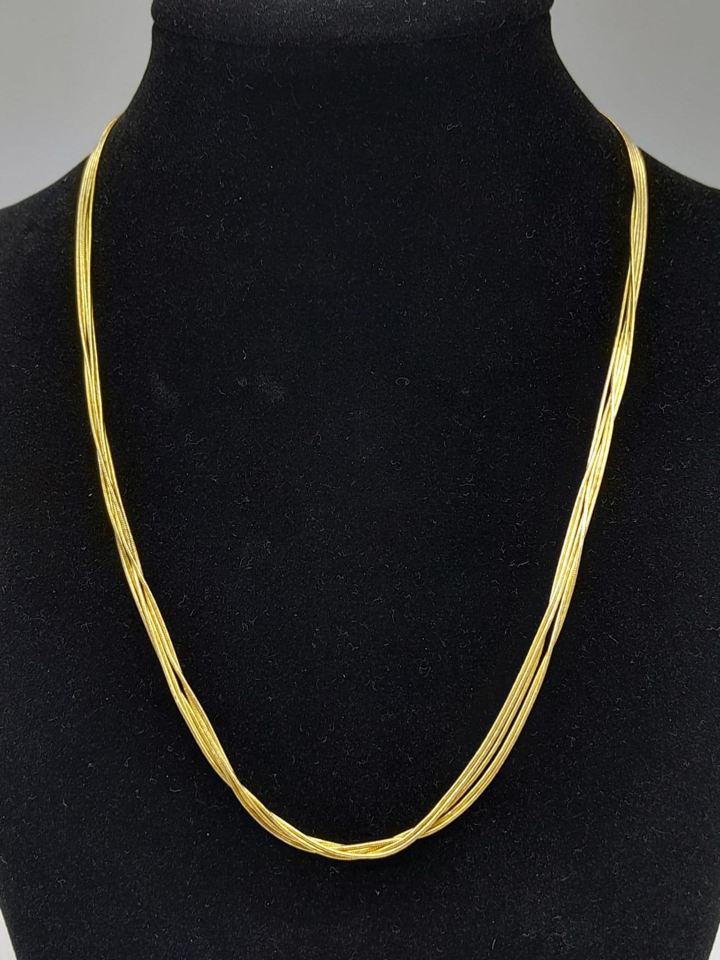 A very feminine, 9 K yellow gold, four chain necklace. length: 43 cm, weight: 9 g.