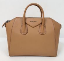 A Givenchy Antigona Leather Shoulder Bag. Brown leather textured exterior. Cream textile interior