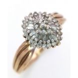 A 9K YELLOW GOLD FANCY DIAMOND CLUSTER RING WITH MIXED CUTS. 0.25CT. 2.8G SIZE P