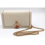 A Gucci Diana Mini Bag. Cream leather exterior with bamboo and gold tone monogram and chain shoulder