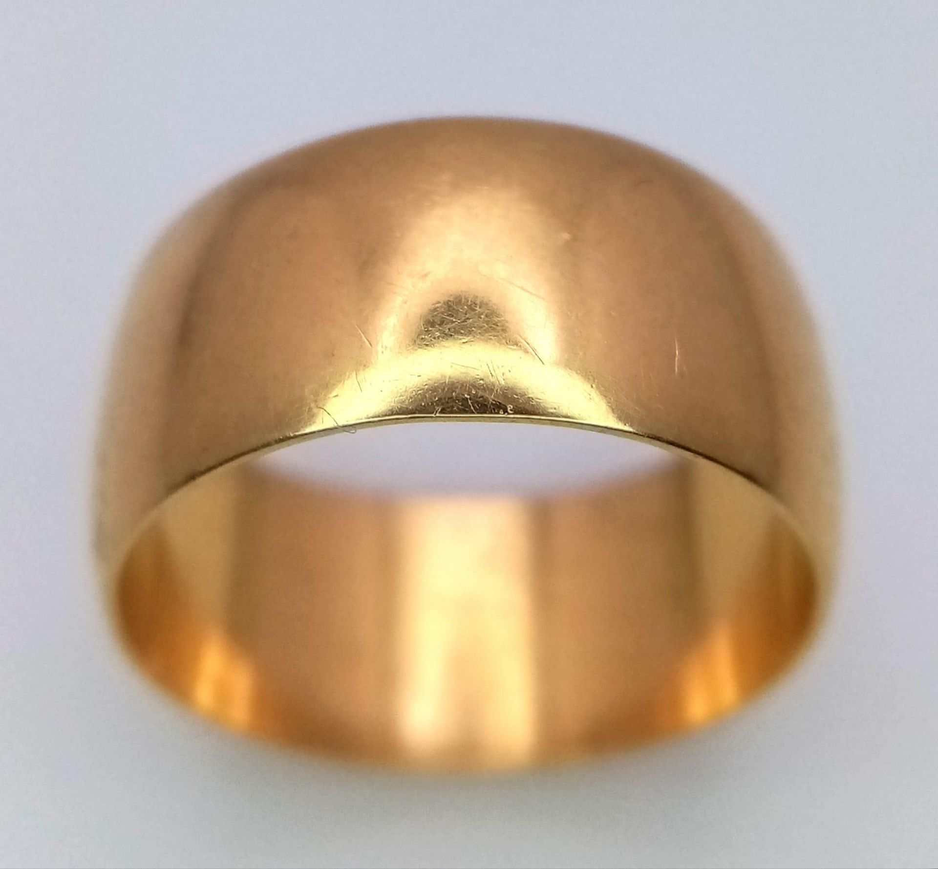 A Vintage 18K Yellow Gold Band Ring. 8mm width. Size K. 5.3g weight. Full UK hallmarks.