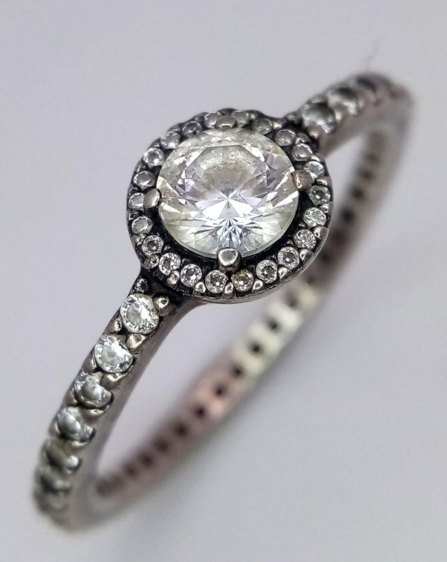 A fancy 925 silver Pandora Zirconia solitaire ring with full eternity round CZ. Total weight 2.