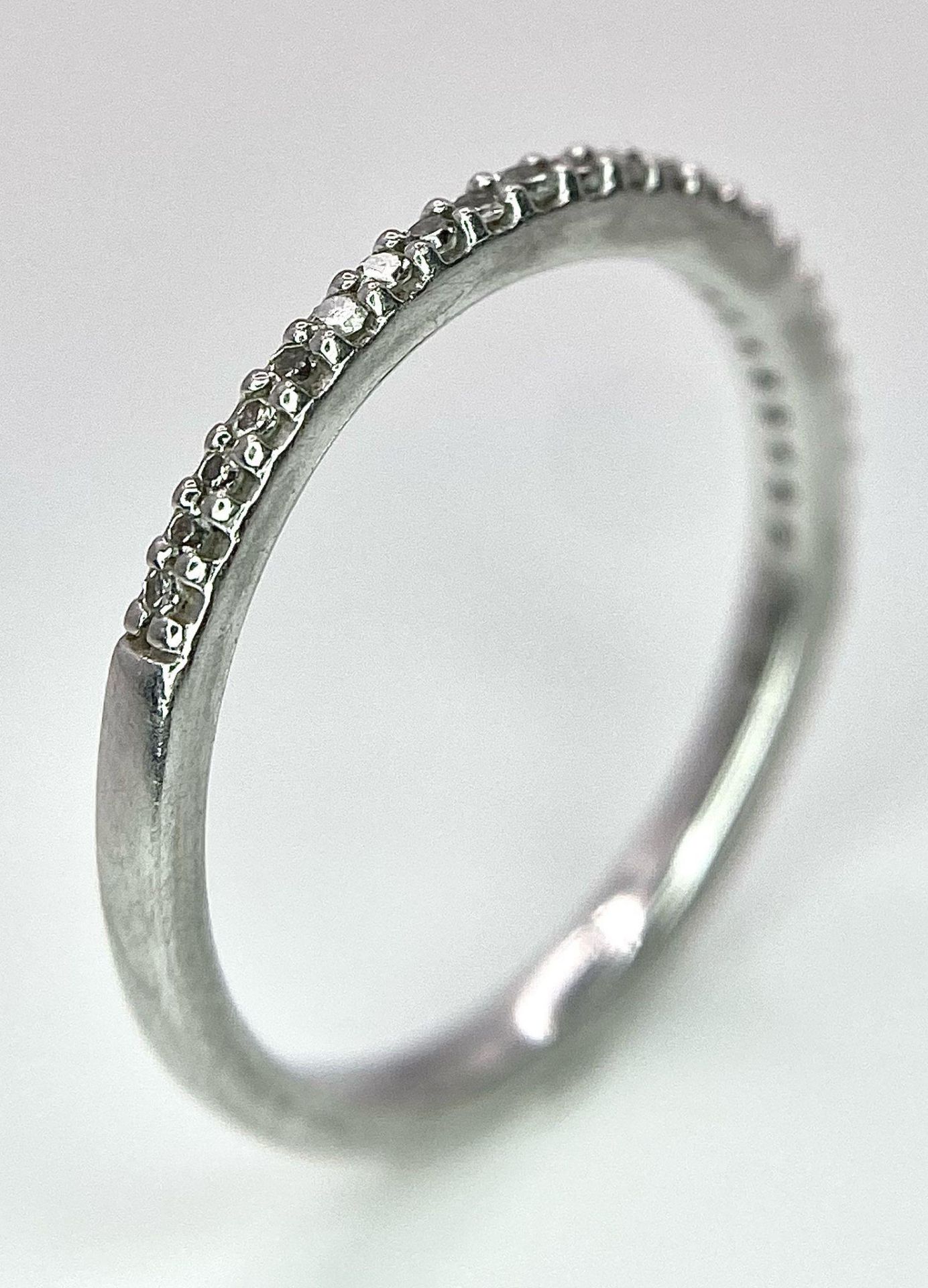 A 950 PLATINUM DIAMOND SET BAND RING. TOTAL WEIGHT 2.5G. SIZE K - Image 3 of 6