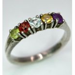 A vintage 925 silver multi-colour gemstone ring. Total weight 2.45G. Size O.