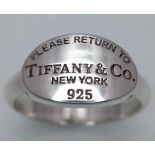 A Please Return to Tiffany & Co. Silver Signet Ring. Comes with a Tiffany pouch. Size O. Ref: 016081