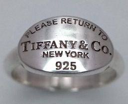 A Please Return to Tiffany & Co. Silver Signet Ring. Comes with a Tiffany pouch. Size O. Ref: 016081