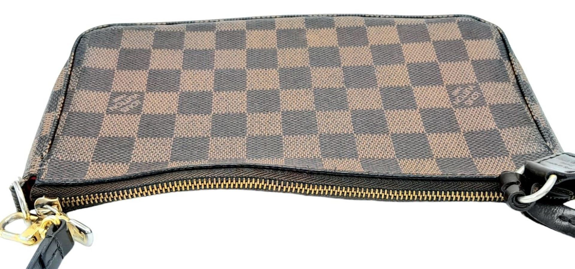 A Louis Vuitton Damier Ebene Pochette with Leather Exterior. Top Zip Closure. Red Fabric Lining with - Image 4 of 7
