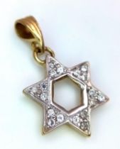 A Diamond Encrusted Star of David pendant. 3cm