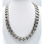 A LOUIS VUITTON HEAVY SILVER CURB LINK NECK CHAIN . WITH ALL LINKS HAVING THE "LV"MARKINGS .