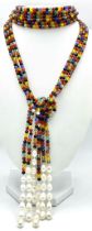 A very interesting necklace consisting of three very long (125 cm) strands of multicoloured beads