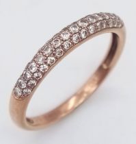 A 9K ROSE GOLD 0.33CT DIAMOND BAND RING. TOTAL WEIGHT 1.6G. SIZE O