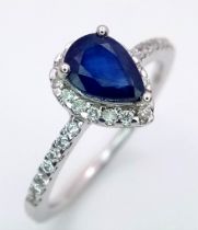 18K WHITE GOLD DIAMOND & SAPPHIRE RING, WITH A PEAR SHAPED SAPPHIRE CENTRE AND SURROUNDED BY