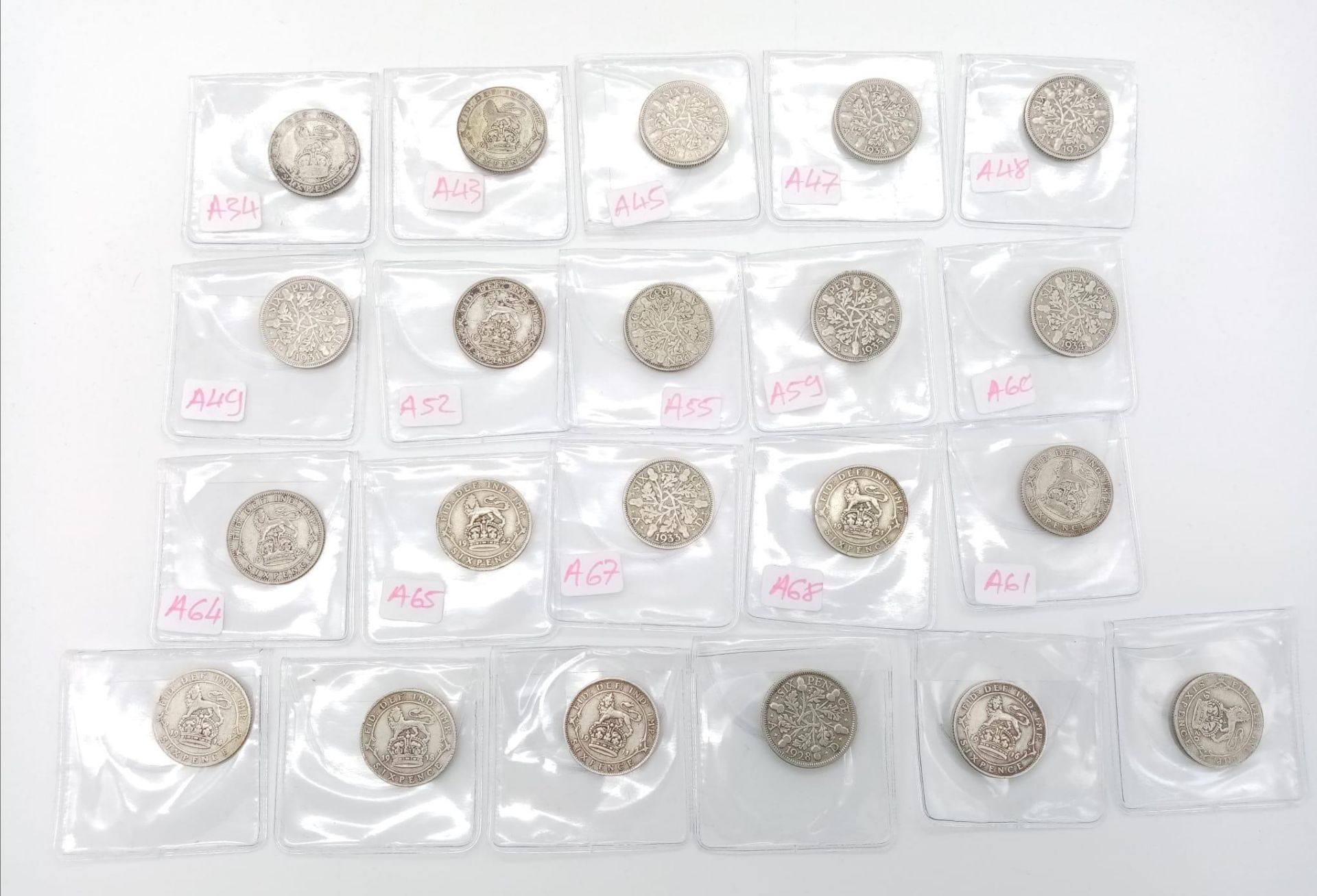 21 George V Pre 1947 Six Pence Silver Coins. 1911- 36 range. Good grades but please see photos.