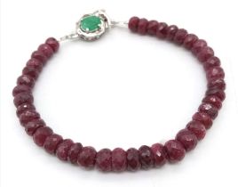A 100ctw Faceted Rondelle Ruby Gemstone Bracelet with Emerald Clasp. Set in 925 Silver. 19cm length.