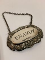 Vintage SILVER BRANDY DECANTER LABEL. Having attractive surround of Shells and Leaves. Full UK
