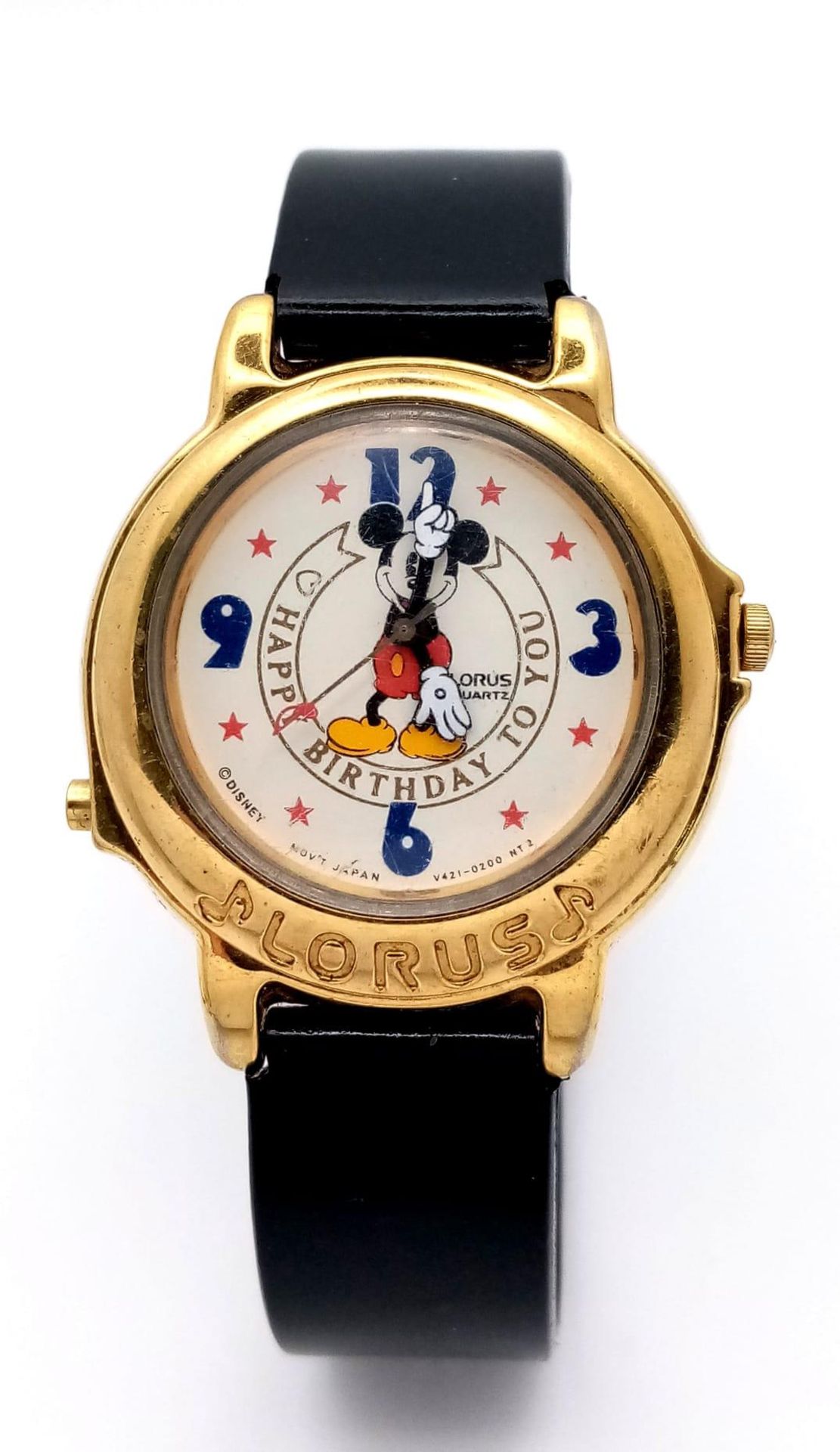 A Lorus Mickey Mouse Happy Birthday Quartz Watch. Black leather strap. Gilded case - 33mm. Mickey