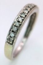 A 9K Gold and Diamond Half Eternity Ring. 0.20ctw. Size N. 2g total weight.
