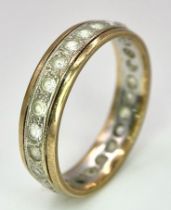 A 9 K yellow gold, stone set, eternity ring. One stone missing. Size: O, weight: 2.7 g.