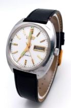 A Citizen Automatic 21 Jewel Gents Watch. Black leather strap. Stainless steel case - 37mm. White