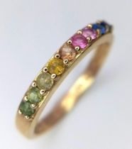 A 14k Yellow Gold Multi-Gemstone Ring. Includes sapphires and peridots. Size I/J. 1.66g weight.