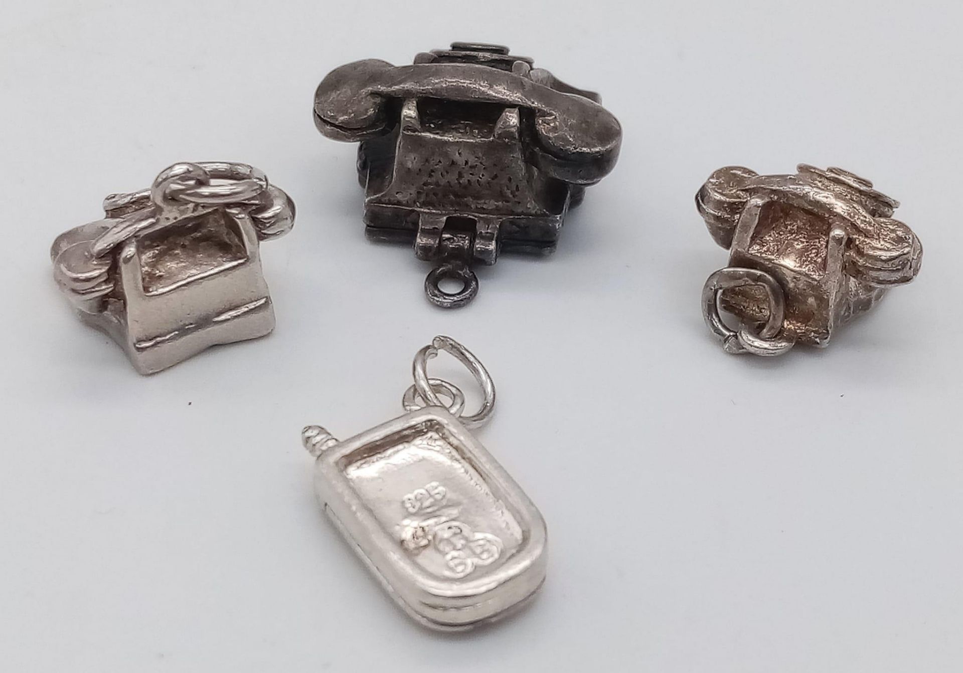 4 X STERLING SILVER TELEPHONE CHARMS - 3 OLD SCHOOL PHONES AND A FLIP MOBILE. 14.5G - Bild 2 aus 3