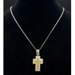 An 18K White and Yellow Gold Diamond Encrusted Cross Pendant on an 18K White Gold Disappearing
