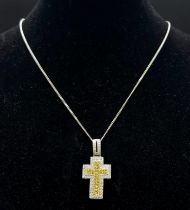 An 18K White and Yellow Gold Diamond Encrusted Cross Pendant on an 18K White Gold Disappearing
