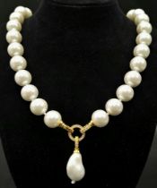 A South Sea Pearl Shell White Bead Necklace with a Baroque Pearl Pendant. Large glossy 14mm beads.