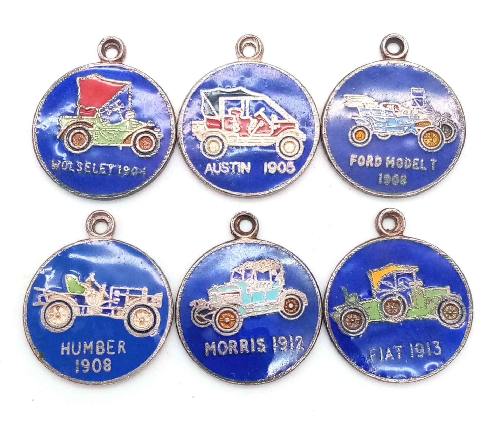 A SELECTION OF 6 STERLING SILVER ENAMELLED VINTAGE CAR CHARMS TO INCLUDE: FORD MODEL T 1908, FIAT