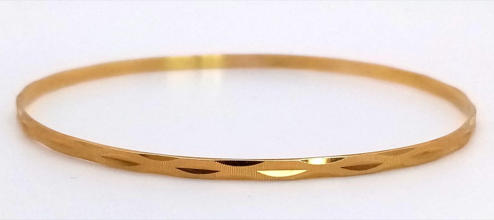 A 9K Yellow Gold Thin Bangle. 3mm width. 6.5cm inner diameter. 5.75g weight. - Image 3 of 4