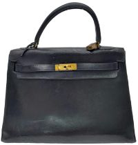 A Vintage Hermes Kelly Handbag with Padlock (missing key) and Belt. Interior Pocket. A Restoration