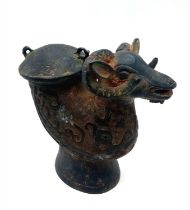 An Antique Chinese Bronze Ram's Head Lidded Drinking Vessel. Nice patina with ornate decorative work