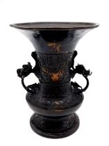 An Antique 18th Century Chinese Bronze Gu Vase Decorated in Low Relief with Rolling Waves and