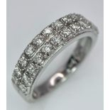 A 9K WHITE GOLD 2 ROW 0.25CT DIAMOND BAND RING. TOTAL WEIGHT 3.4G. SIZE O