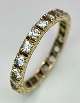 A 9k yellow gold full eternity band ring set with cubic zirconia 2.5g, size R.