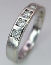 An 18K White Gold Diamond Half-Eternity Ring. 0.25ctw of diamonds. Size L/M. 3.95g total weight.