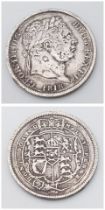 An 1818 George III Silver Shilling. F/VF grade but please see photos.