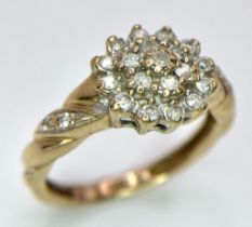 A 9K YELLOW GOLD 0.25CT DIAMOND CLUSTER RING. TOTAL WEIGHT 2.2G. SIZE J