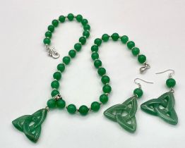 A quality green jade necklace with pendant and earrings in an “eternal triangle” design