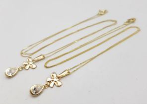 Two 9K Yellow Gold Disappearing Necklaces with White Stone Pendants. 40cm necklace lengths. 1.45g