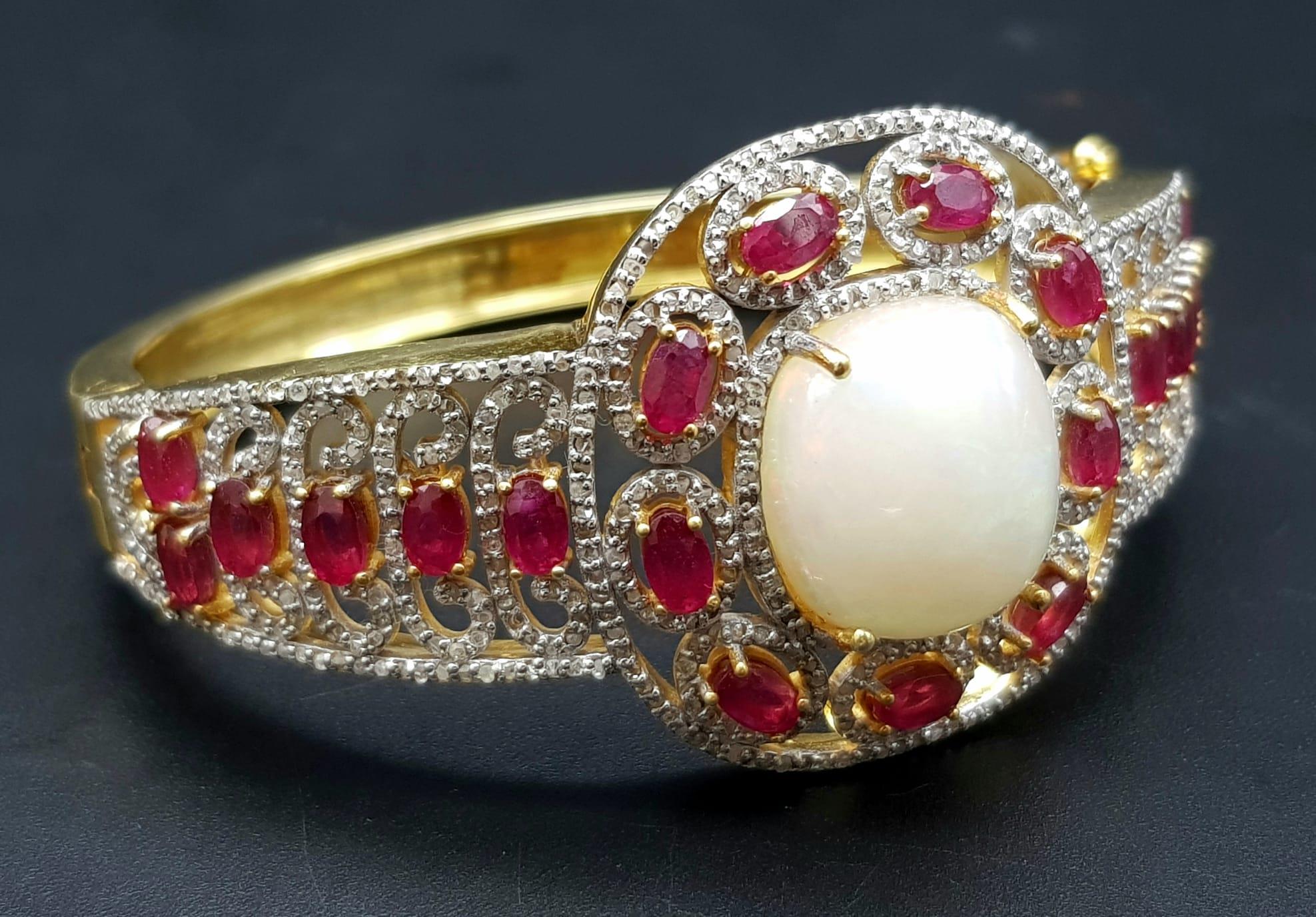 A Wonderful Majestic Colour-Play 12ct Opal and Ruby Gemstone Cuff Bracelet with Diamond Accents.