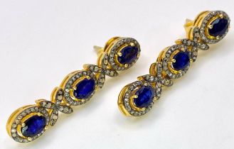 A Pair of Blue Sapphire and Diamond Drop Earrings. Set in gilded 925 Silver. Sapphire ovals - 8ctw