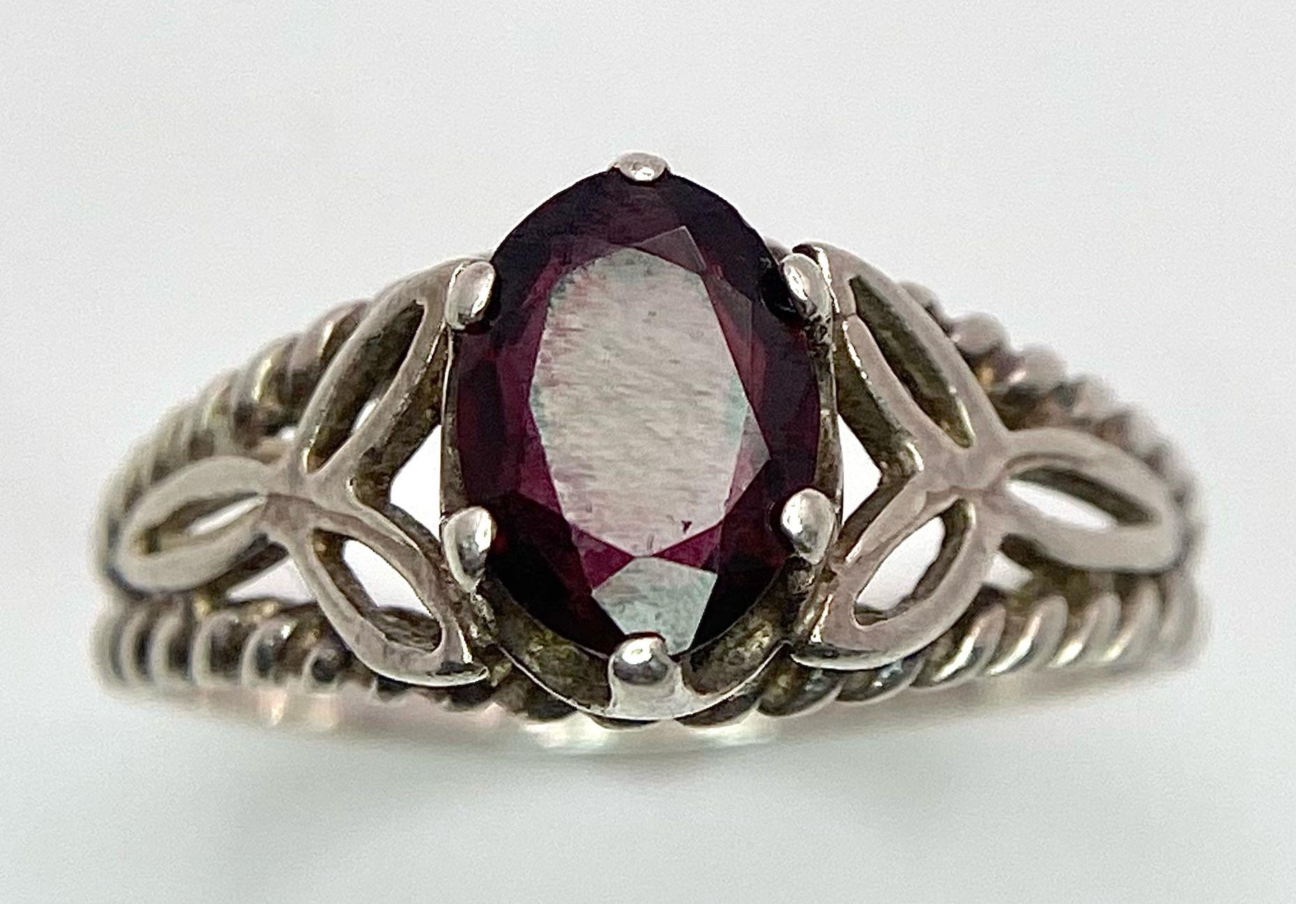 A vintage sterling silver faceted Garnet solitaire ring with further decoration on shoulder. Come - Image 4 of 9