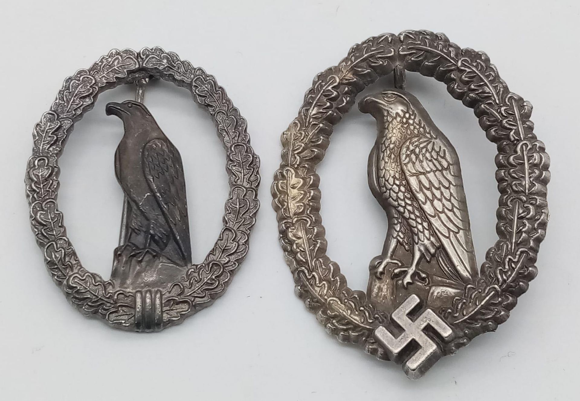 WW2 German Retired Pilots Badge with a smaller 1957 version without the Swastika, so it could be