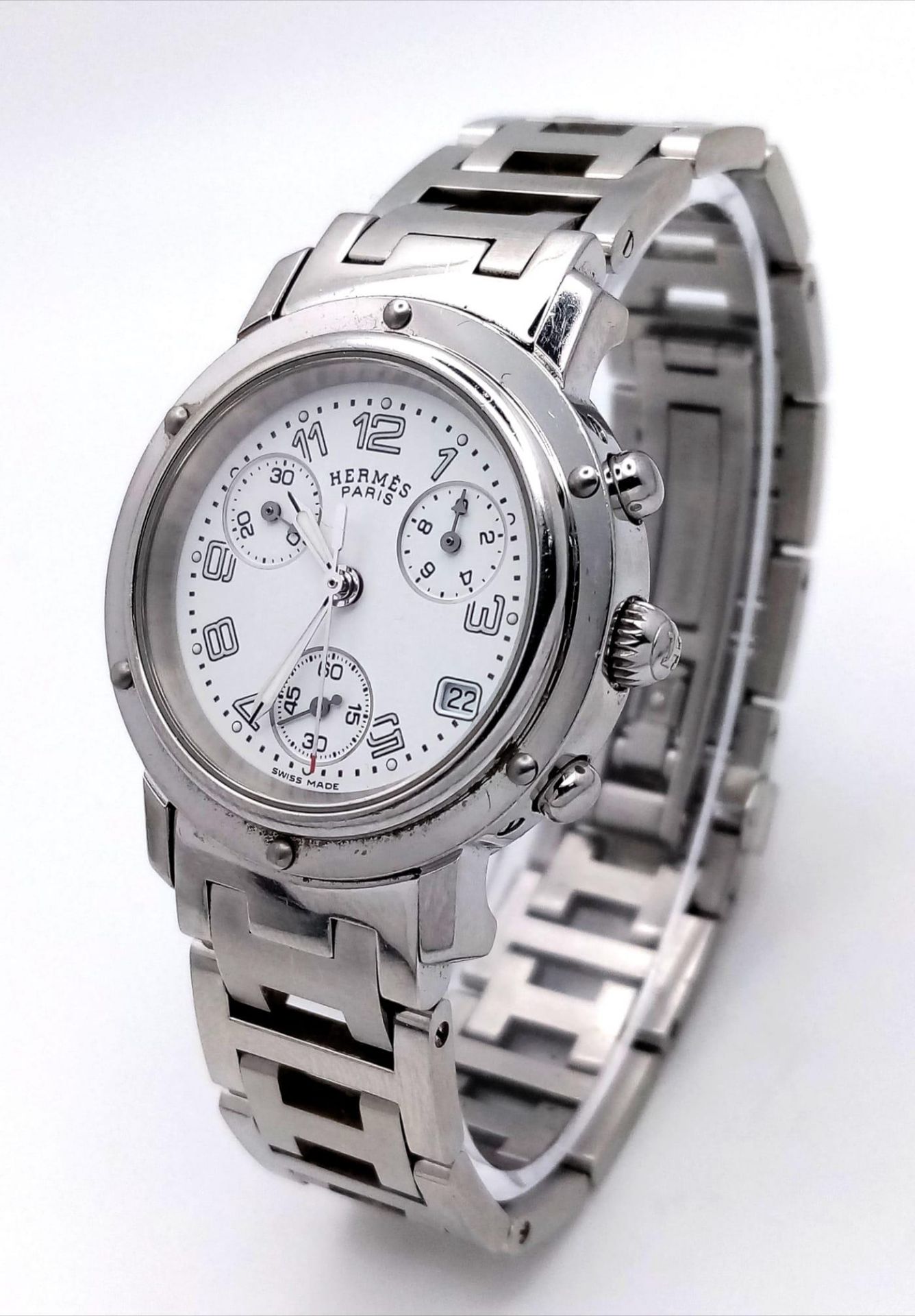 A "HERMES" OF PARIS STAINLESS STEEL CHRONOGRAPH LADIES WATCH WITH 3 SUBDIALS , DATE BOX AND WHITE